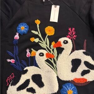 Anthropologie Black Sweatshirt with Embroidered Orange Floral Detail